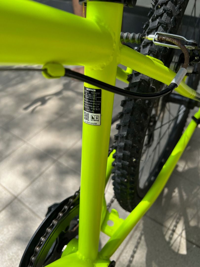 Decathlon 24" Bicycle with Training Wheels - Bright Yellow (Category: Bicycles) located in Quezon City. Submitted by amazing_grains910 (Listing ID 1444378612, Image 3). Description: - Decathlon 24" aluminum frame bike with 7 speeds - For 9-12 years old children (135 to 150 cm) - Comes with training wheels for stability - Front suspension for a smoother ride - Ideal for beginner cyclists - Seat shows slight wear but is fully functional - Includes 