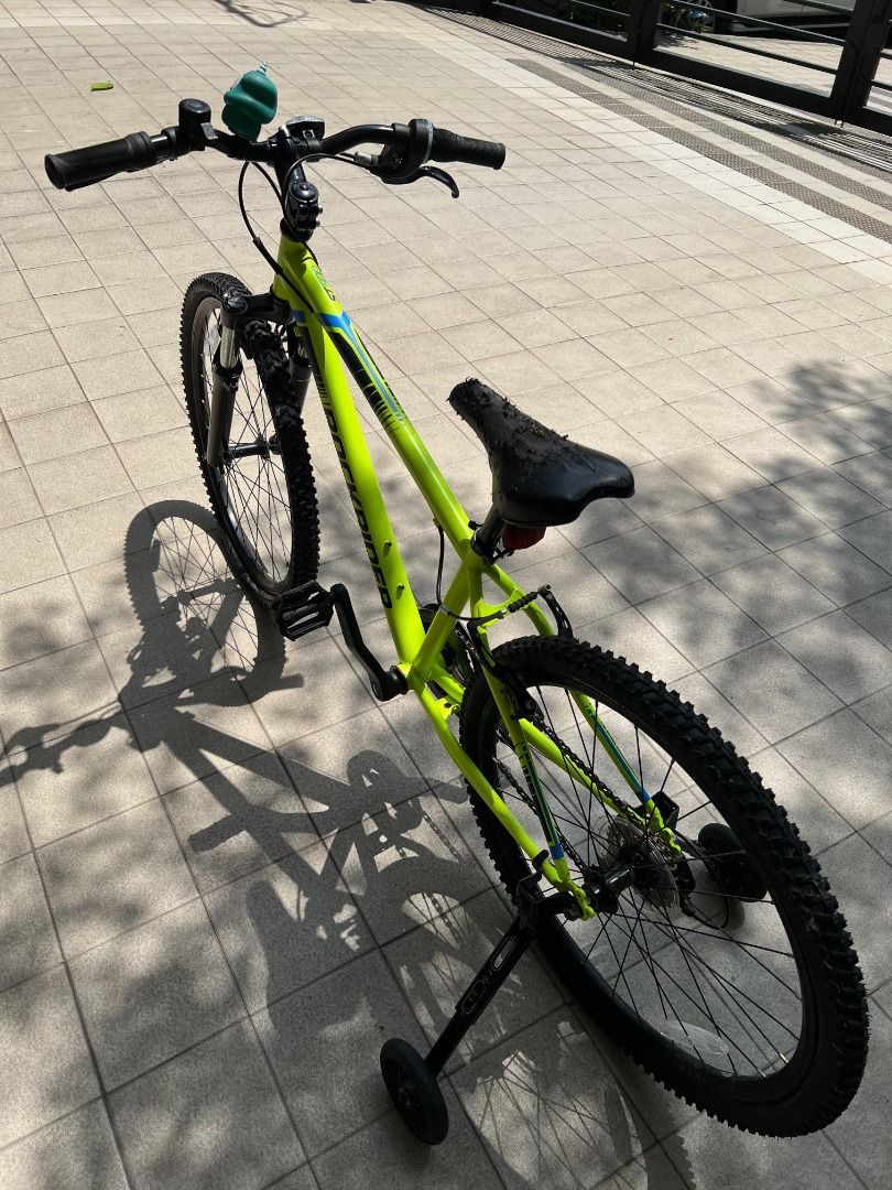 Decathlon 24" Bicycle with Training Wheels - Bright Yellow (Category: Bicycles) located in Quezon City. Submitted by amazing_grains910 (Listing ID 1444378612, Image 2). Description: - Decathlon 24" aluminum frame bike with 7 speeds - For 9-12 years old children (135 to 150 cm) - Comes with training wheels for stability - Front suspension for a smoother ride - Ideal for beginner cyclists - Seat shows slight wear but is fully functional - Includes 
