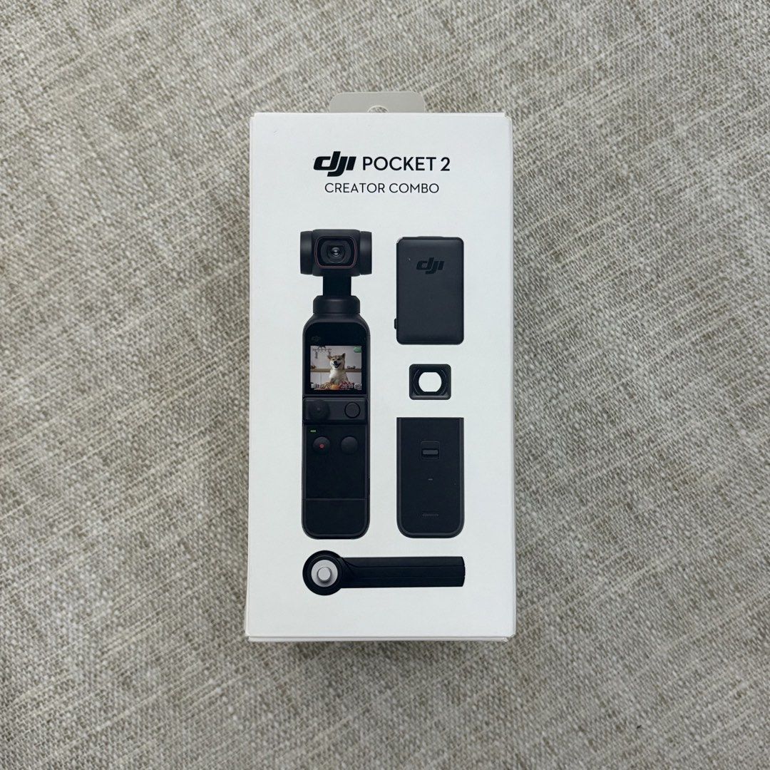 DJI Pocket 2 Creator Combo Gimbal Camera (Category: Cameras) located in Paranaque City. Submitted by aamlicup51680 (Listing ID 1444321868, Image 1). Description: - DJI Pocket 2 Creator Combo - Includes gimbal camera, charging case, wind protection mic, and other accessories - Ideal for vlogging and capturing smooth footage - All items are in the box.