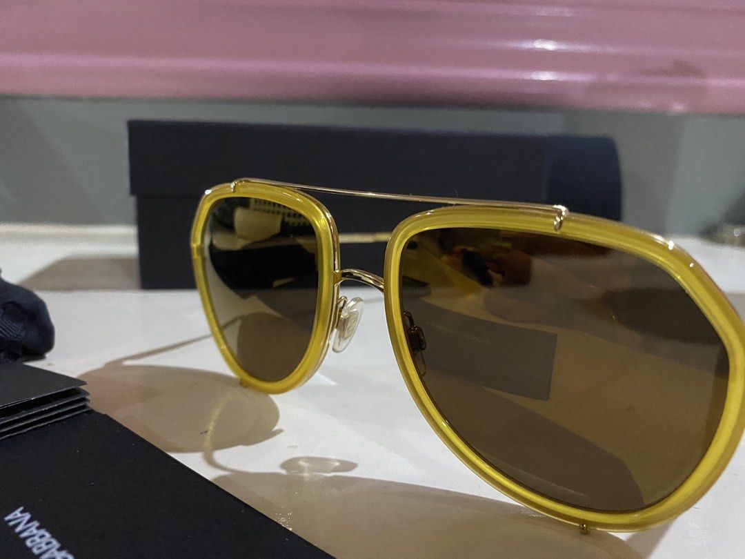 Dolce & Gabbana Aviator Sunglasses Yellow Frame (Category: Sunglasses & Eyewear) located in Makati City. Submitted by finallydecluttering.2026 (Listing ID 1444469932, Image 2). Description: - Authentic Dolce & Gabbana aviator sunglasses bought from sunglass hut - Stylish gold frame details - Classic brown lenses - Comes with original box and dust cloth -rfs: not my style anymore 🥲.