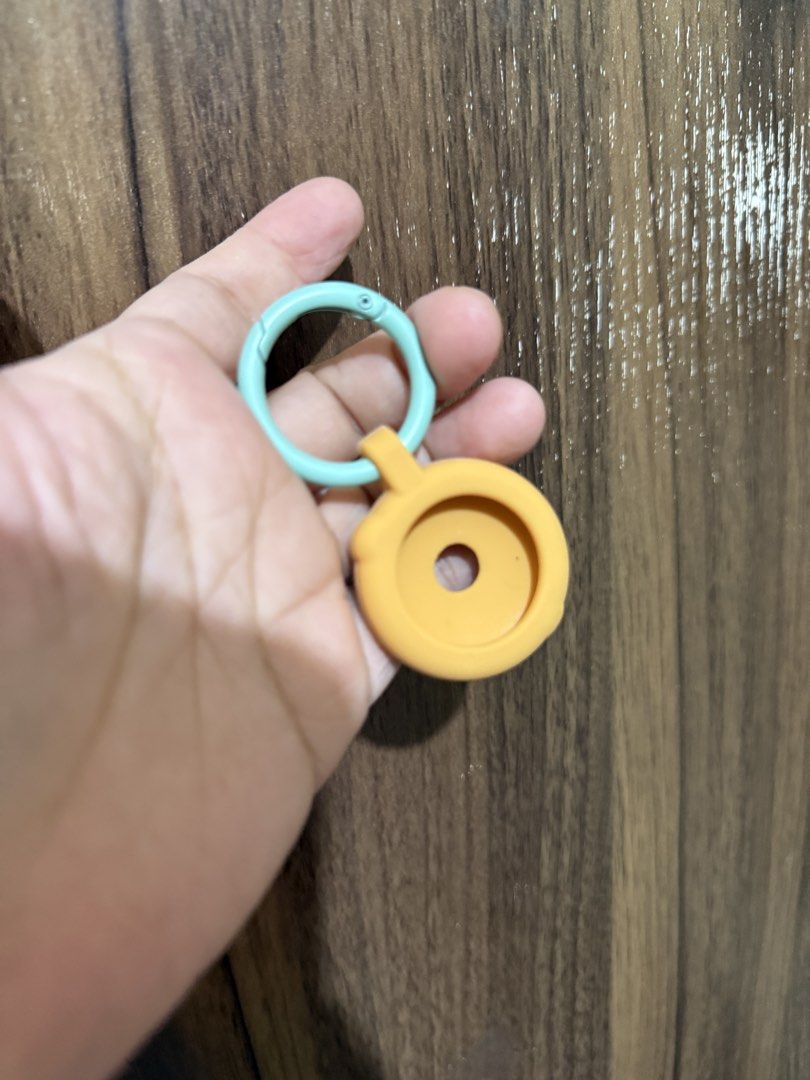 Donut Keychain with Teal Ring for apple airtag (Category: Other Accessories) located in Batangas. Submitted by pixie_clearance (Listing ID 1444435693, Image 2). Description: - Adorable donut keychain - Features a teal ring attachment - Comes with a fun orange silicone donut cover - Ideal for apple airtag.