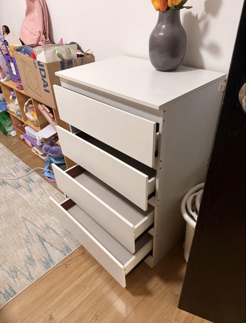 Dresser / Drawers (Category: Shelves, Cabinets & Racks) located in Taguig. Submitted by samlibao (Listing ID 1444380765, Image 2). Description: - White 4-drawer chest - Sturdy drawers with reinforced bottom support - Smooth pull-out action for easy access - Simple installation: only a screwdriver required - Dimensions: 89cm (Height) x 60cm (Width) x 41cm (Depth) - Total weight capacity: 75kg - Ideal for decluttering and organizing your space.