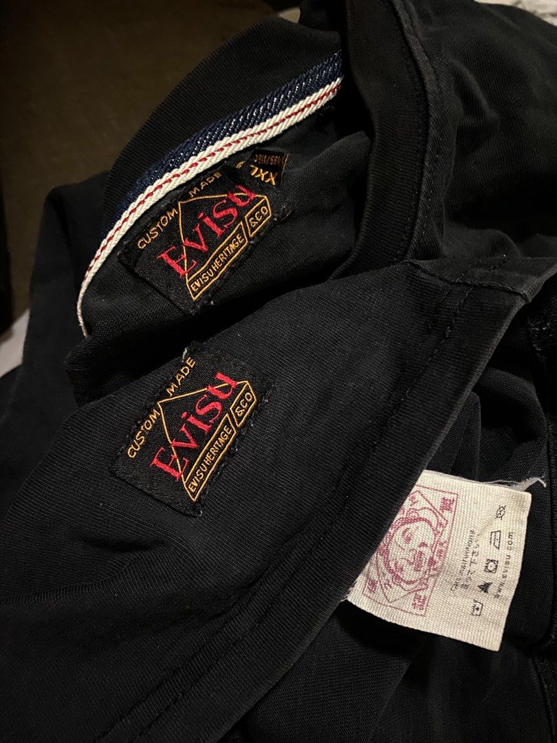 EVISU Heritage & Co. Black T-Shirt (Category: Tshirts & Polo Shirts ) located in Batangas. Submitted by fezywez (Listing ID 1444350889, Image 3). Description: - Brand: Evisu - Color: Black - Size: XXL - Design: Large graphic on back, Evisu logo on front - Material: Quality fabric - Occasion: Casual wear.