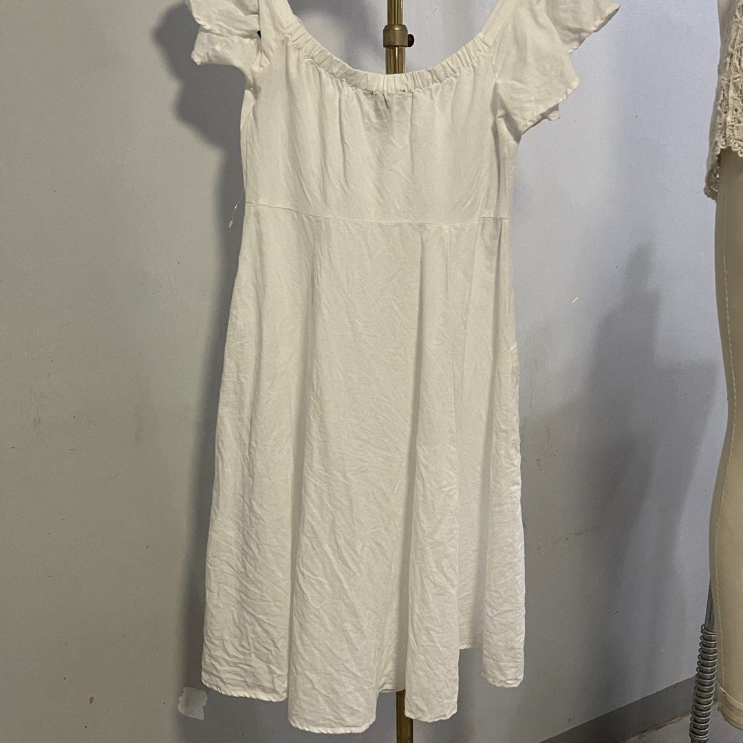 Forever 21 White Off-Shoulder Button-Up Midi Dress (Category: Dresses) located in General Trias. Submitted by 1992thelabel (Listing ID 1444415767, Image 3). Description: - White off-shoulder midi dress - Brand: Forever 21 - Button-up front - Flutter sleeves - Two front pockets - Elasticated neckline for a comfortable fit - Ideal for casual outings or beach days.