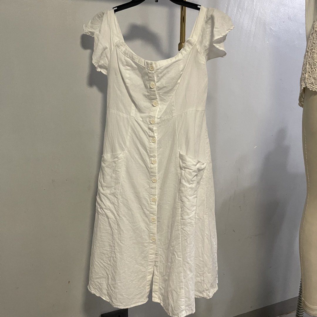 Forever 21 White Off-Shoulder Button-Up Midi Dress (Category: Dresses) located in General Trias. Submitted by 1992thelabel (Listing ID 1444415767, Image 1). Description: - White off-shoulder midi dress - Brand: Forever 21 - Button-up front - Flutter sleeves - Two front pockets - Elasticated neckline for a comfortable fit - Ideal for casual outings or beach days.