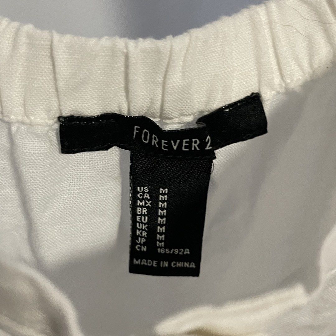 Forever 21 White Off-Shoulder Button-Up Midi Dress (Category: Dresses) located in General Trias. Submitted by 1992thelabel (Listing ID 1444415767, Image 2). Description: - White off-shoulder midi dress - Brand: Forever 21 - Button-up front - Flutter sleeves - Two front pockets - Elasticated neckline for a comfortable fit - Ideal for casual outings or beach days.