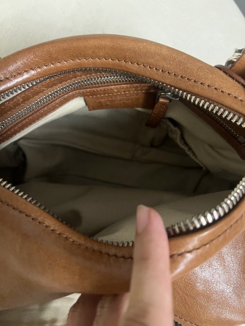 Givenchy Brown Leather Nightingale Bag (Category: Luxury Bags & Wallets) located in Cainta. Submitted by kylekicks99 (Listing ID 1444427751, Image 3). Description: - Authentic brown leather Givenchy Nightingale bag - Features a detachable strap - Interior lined with fabric Item is in Cainta Rizal .