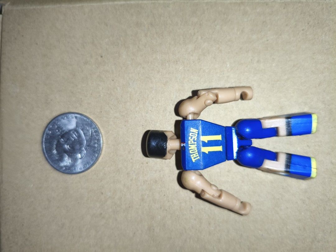 Golden State Warriors Klay Thompson Action Figure (Category: Figurines & Statues) located in Manila. Submitted by v2Zuio (Listing ID 1444323249, Image 2). Description: - Klay Thompson action figure - Golden State Warriors uniform (blue with yellow accents) - Jersey number 11 on the back - Poseable limbs for dynamic display - Coin-sized, making it a compact collectible - Ideal for any Warriors fan or action figure collector.