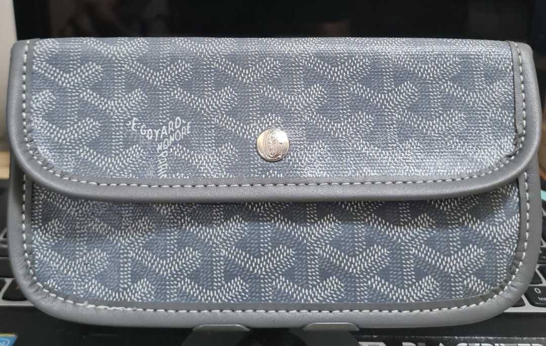 Goyard Paris Pouch (Category: Luxury Bags & Wallets) located in Manila. Submitted by sevyaleinad (Listing ID 1444456923, Image 1). Description: - Authentic Goyard pouch - Classic grey and white chevron pattern - Secure snap button closure - Small D-ring on the back - Made in France - Ideal for organizing essentials.