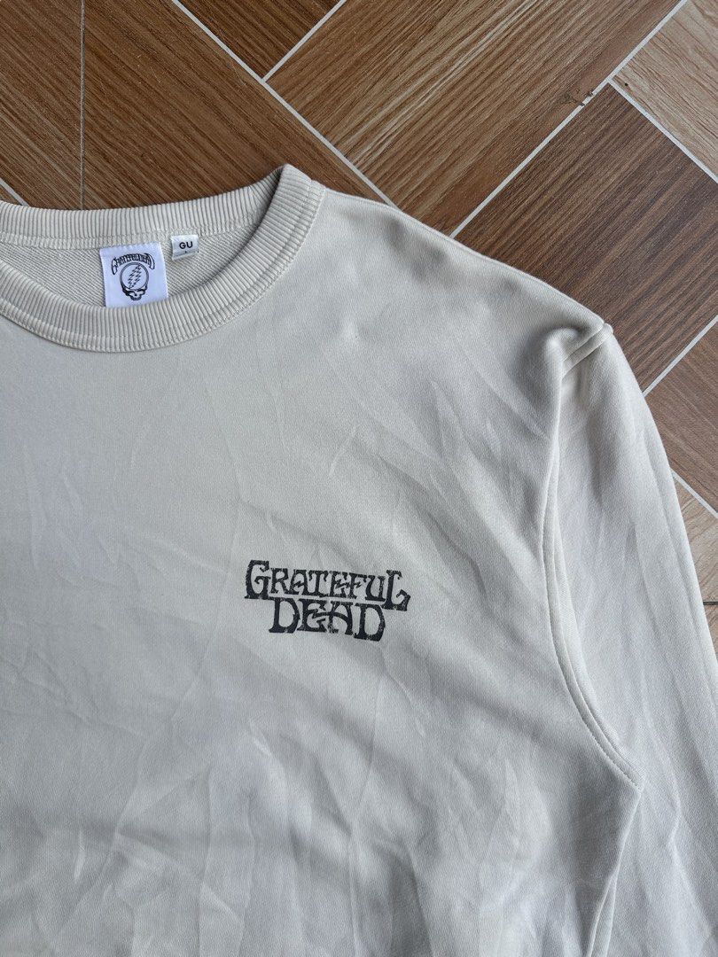 GU Grateful Dead Crewneck Sweatshirt (Category: Coats, Jackets and Outerwear) located in Davao. Submitted by kurttyyo (Listing ID 1444386462, Image 3). Description: - Cream colored crewneck sweatshirt from GU - Features Grateful Dead graphics - Small Grateful Dead logo on front left chest - Large graphic on back with dancing bears around the Earth - Ribbed cuffs, collar, and hem - Size L GU X GD L | 24 x 27 Excellent no issues 700.