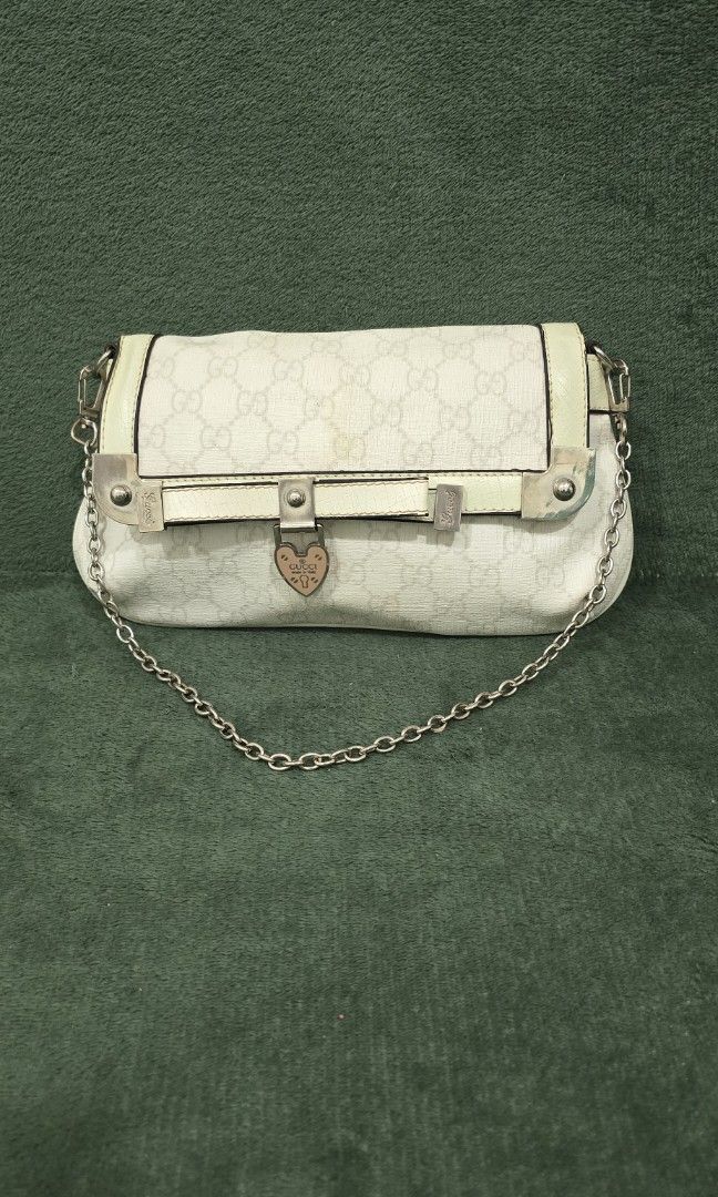 Gucci GG Monogram Heart Lock Chain Mini Bag - coded (Category: Luxury Bags & Wallets) located in Bacoor. Submitted by deux_trading_corporation (Listing ID 1444411507, Image 1). Description: 24k on 2ndhand market. condition: Rank AB - has normal signs of wear but no damage whatsoever payment first. you can always ask for discount/tawad but no to sobrang barat. no reservation. always check all the photos. some photo/s indicate the flaw..