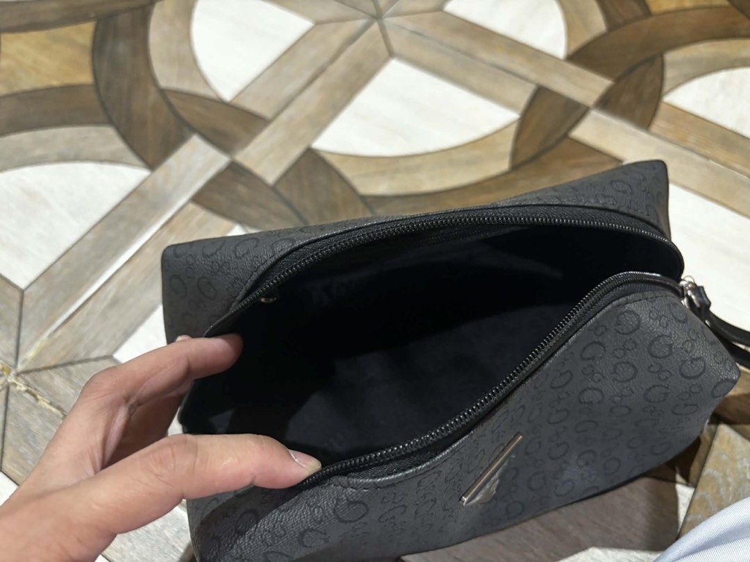 Guess Cosmetic Bag Black L Size (Category: Purses & Pouches) located in Quezon City. Submitted by lavl00 (Listing ID 1444451928, Image 3). Description: - Authentic Guess cosmetic bag, Size L - Features iconic all-over G pattern - Two separate zippered compartments for organization - Brand new with original tag from Ross - Ideal for travel or everyday use.