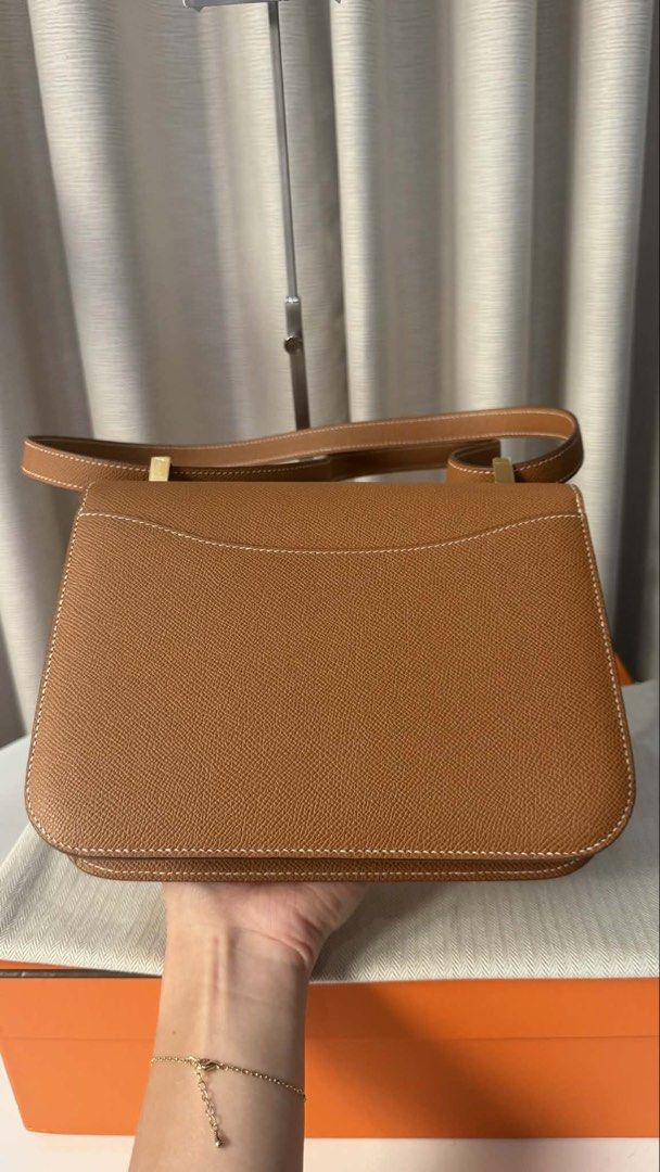 Hermes Constance Bag - Brown Leather (Category: Luxury Bags & Wallets) located in Makati City. Submitted by dgcurated09 (Listing ID 1444358418, Image 3). Description: - Classic Hermes Constance24 bag Stamp U - Rich brown grained leather - Elegant gold hardware - Versatile top handle and shoulder strap - Spacious interior with multiple compartments - Comes with original dust bag and box - A timeless and iconic accessory .