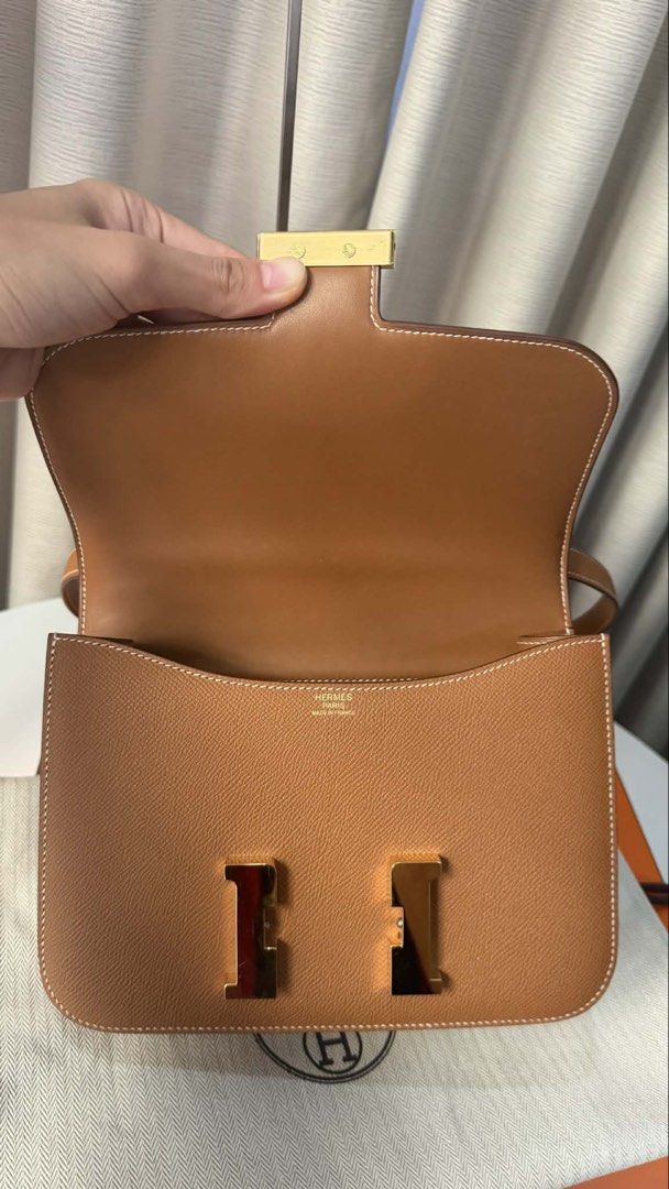 Hermes Constance Bag - Brown Leather (Category: Luxury Bags & Wallets) located in Makati City. Submitted by dgcurated09 (Listing ID 1444358418, Image 2). Description: - Classic Hermes Constance24 bag Stamp U - Rich brown grained leather - Elegant gold hardware - Versatile top handle and shoulder strap - Spacious interior with multiple compartments - Comes with original dust bag and box - A timeless and iconic accessory .