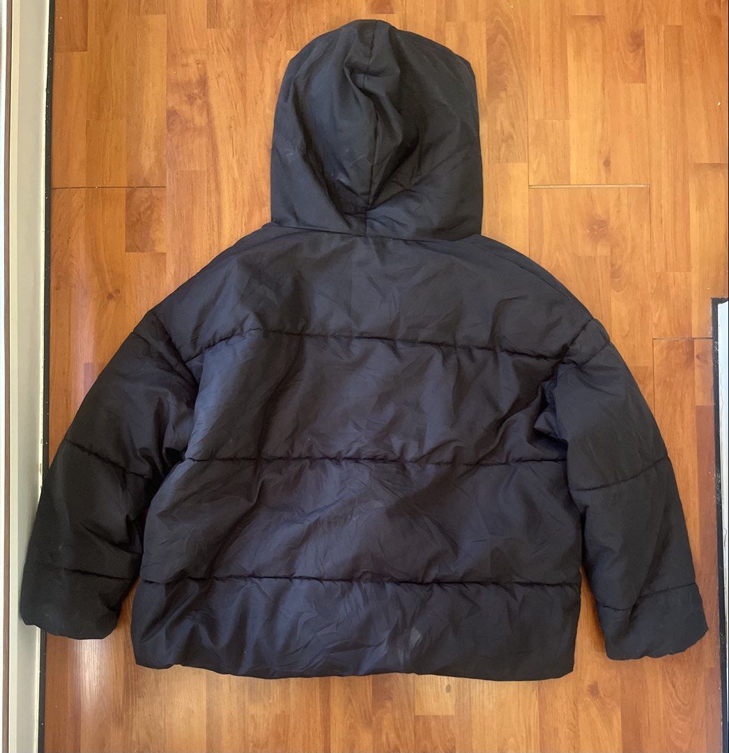 H&M Black Oversized Hooded Puffer Jacket (US 16) (Category: Coats, Jackets and Outerwear) located in Lipa City. Submitted by alexcollectionco (Listing ID 1444409400, Image 2). Description: Trendy H&M black oversized hooded puffer jacket perfect for cozy streetwear, winter travel, or a minimalist gorpcore aesthetic. This thick, insulated puffer coat offers a comfortable vintage puffer look with a dramatic wrap-around collar. Key Features Brand: H&