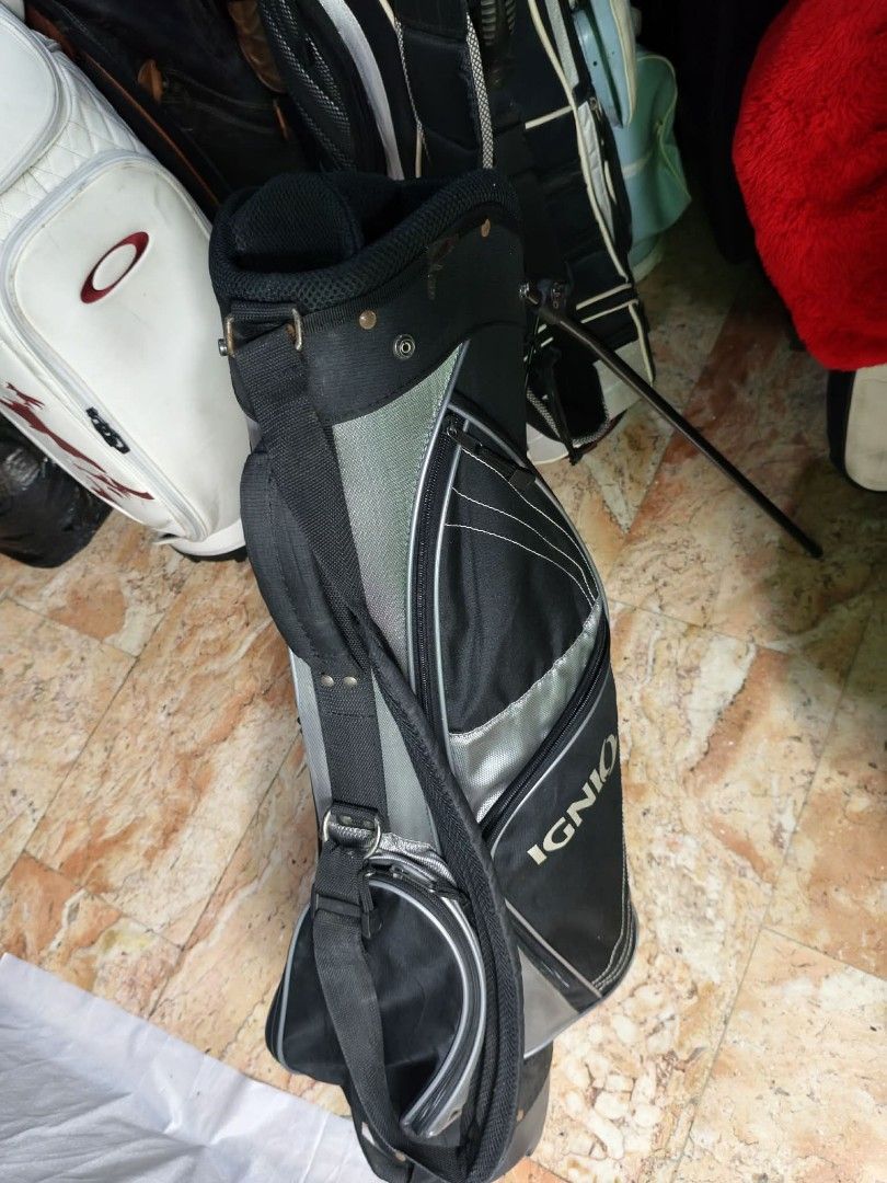Ignio Golf Stand Bag & Oakley Golf Bag (Category: Golf) located in Manila. Submitted by yeonmei5614747 (Listing ID 1444447539, Image 1). Description: - Ignio Stand Bag: Black & Silver, includes strap and legs.No Hood cover.. 2500 - Oakley Golf Bag: White with distinctive logo and graphic.no hood cover. there is issue.. check on images.. price: 2000 .