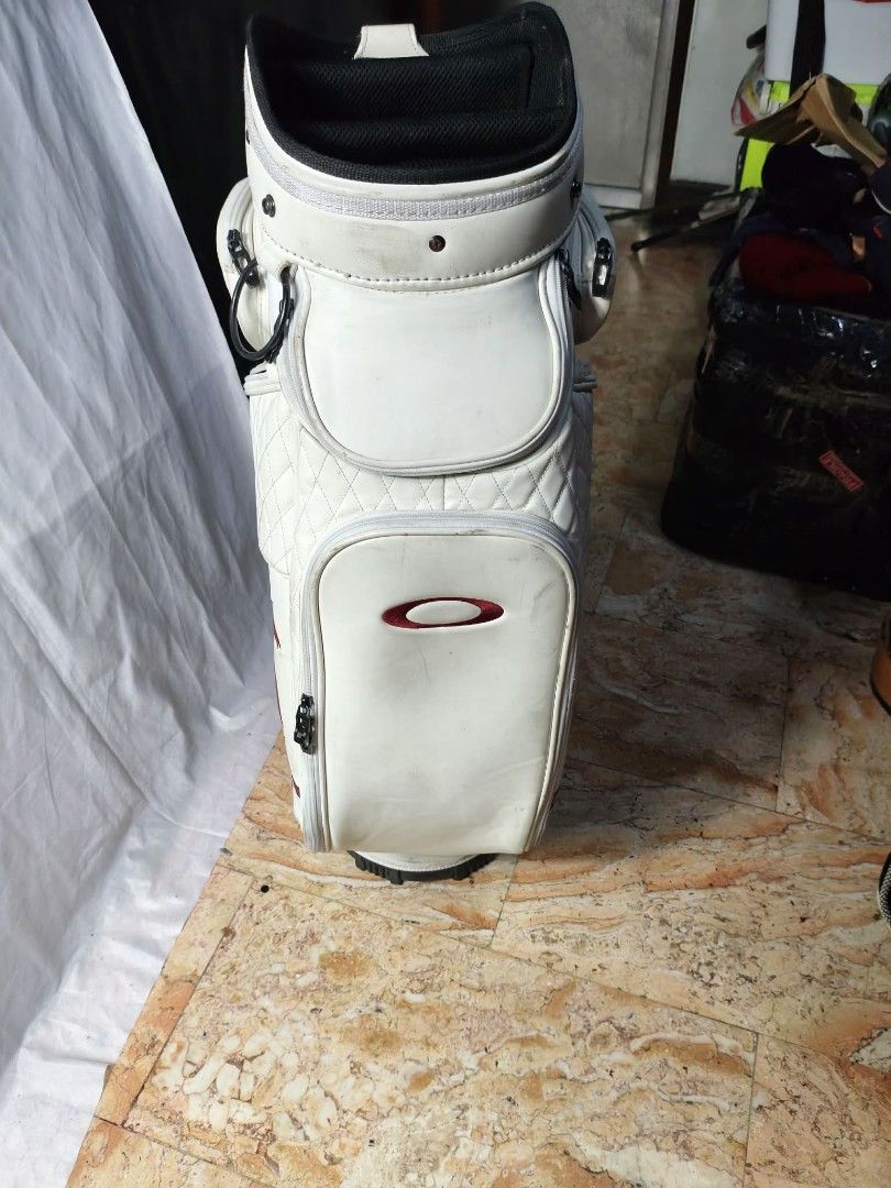 Ignio Golf Stand Bag & Oakley Golf Bag (Category: Golf) located in Manila. Submitted by yeonmei5614747 (Listing ID 1444447539, Image 3). Description: - Ignio Stand Bag: Black & Silver, includes strap and legs.No Hood cover.. 2500 - Oakley Golf Bag: White with distinctive logo and graphic.no hood cover. there is issue.. check on images.. price: 2000 .