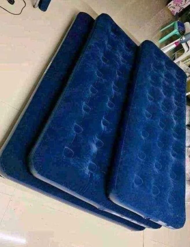 Inflatable Air Mattress Air bed- Double Sizes Available (Category: Bed Frames & Mattresses) located in Manila. Submitted by shaken_29 (Listing ID 1444424109, Image 2). Description: - Blue inflatable air mattresses - Available in single, double, and family sizes - Ideal for camping trips or accommodating extra guests - Made with durable material - Simple to inflate and deflate.