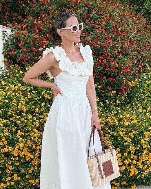 Ivory Ruffle Square Neck Midi Dress (Category: Dresses) located in Pagudpud. Submitted by altheacee063978 (Listing ID 1444350305, Image 1). Description: - Cream white midi dress - Ruffled square neckline - Short flutter sleeves - Open back with cute tie detail - Smocked waist for a flattering fit - Lightweight fabric - Perfect for summer events or beach vacation.