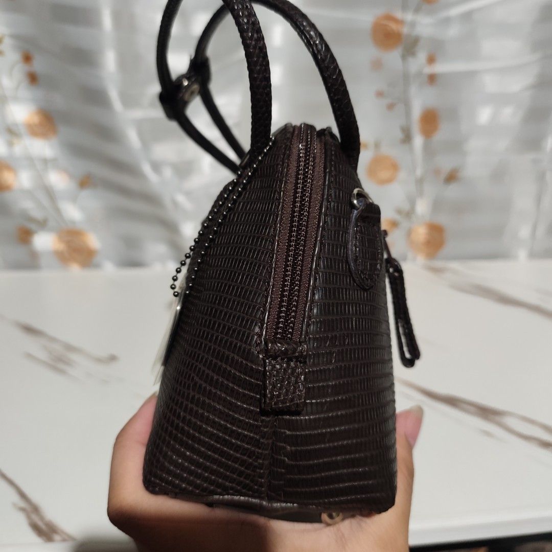JRA Genuine Lizard Skin Shoulder Bag (Category: Shoulder Bags) located in Binalonan. Submitted by jarnimzurccc (Listing ID 1444436170, Image 3). Description: JAPAN sourced! 🌸✨ YKK zipper. Gamuza inner lining. Chocolate brown color in actual. Small size only Dimensions Height: 6.5 inches Length: 8 inches Width: 3 inches.