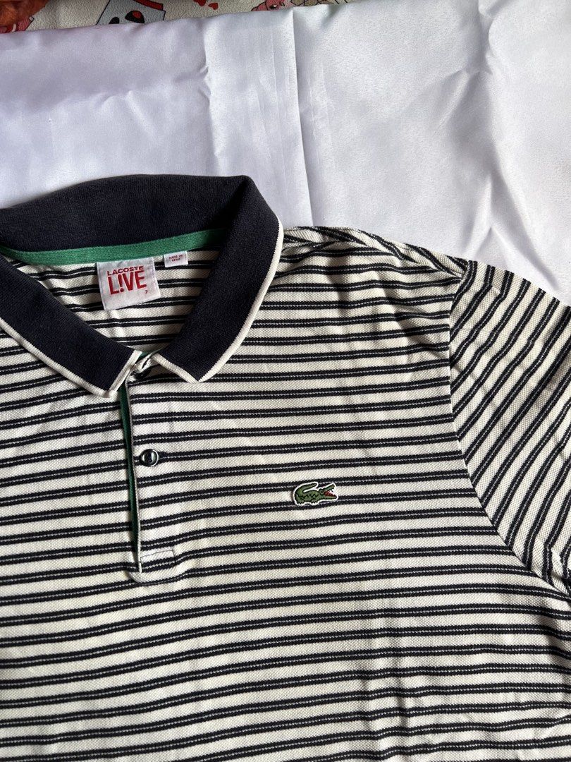 Lacoste Live Striped Polo Shirt (Category: Tshirts & Polo Shirts ) located in Pasay City. Submitted by angeeeende_ (Listing ID 1444493446, Image 2). Description: details: 🩷 original 🩷 classic striped polo shirt 🩷 good condition, no flaws 🩷size 7 on tag (double xl mens) dimensions: shoulder - 46inces width - 54inches length - 65inches ‼️ kindly wash before wearing ‼️.