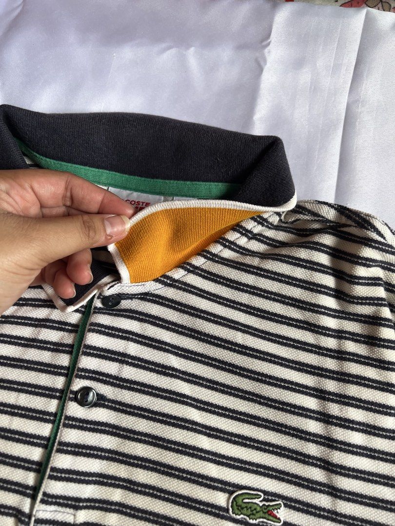 Lacoste Live Striped Polo Shirt (Category: Tshirts & Polo Shirts ) located in Pasay City. Submitted by angeeeende_ (Listing ID 1444493446, Image 3). Description: details: 🩷 original 🩷 classic striped polo shirt 🩷 good condition, no flaws 🩷size 7 on tag (double xl mens) dimensions: shoulder - 46inces width - 54inches length - 65inches ‼️ kindly wash before wearing ‼️.