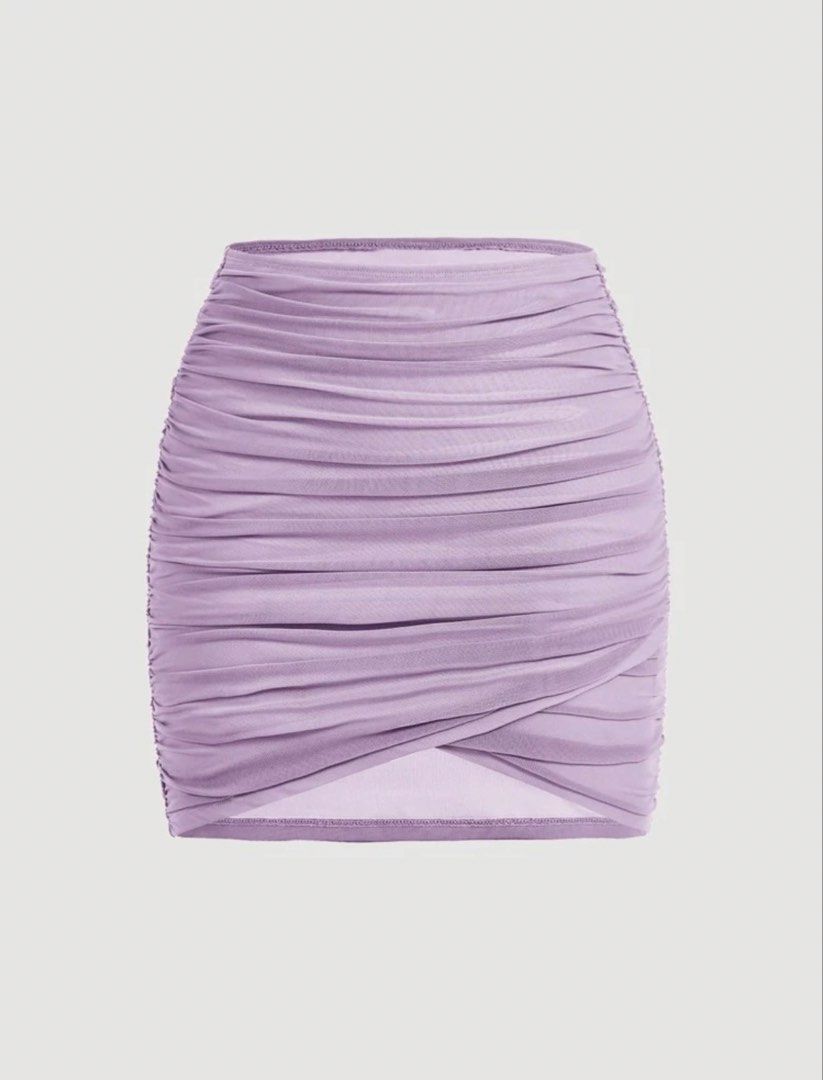 Lavender Ruched Mesh Mini Skirt (Category: Skirts) located in Manila. Submitted by 8728___ (Listing ID 1444311045, Image 1). Description: - Cute lavender mini skirt - Ruched mesh overlay - Crossover hem detail - Stretchy material for comfort - Versatile: dress up or down - Perfect for nights out or casual days.