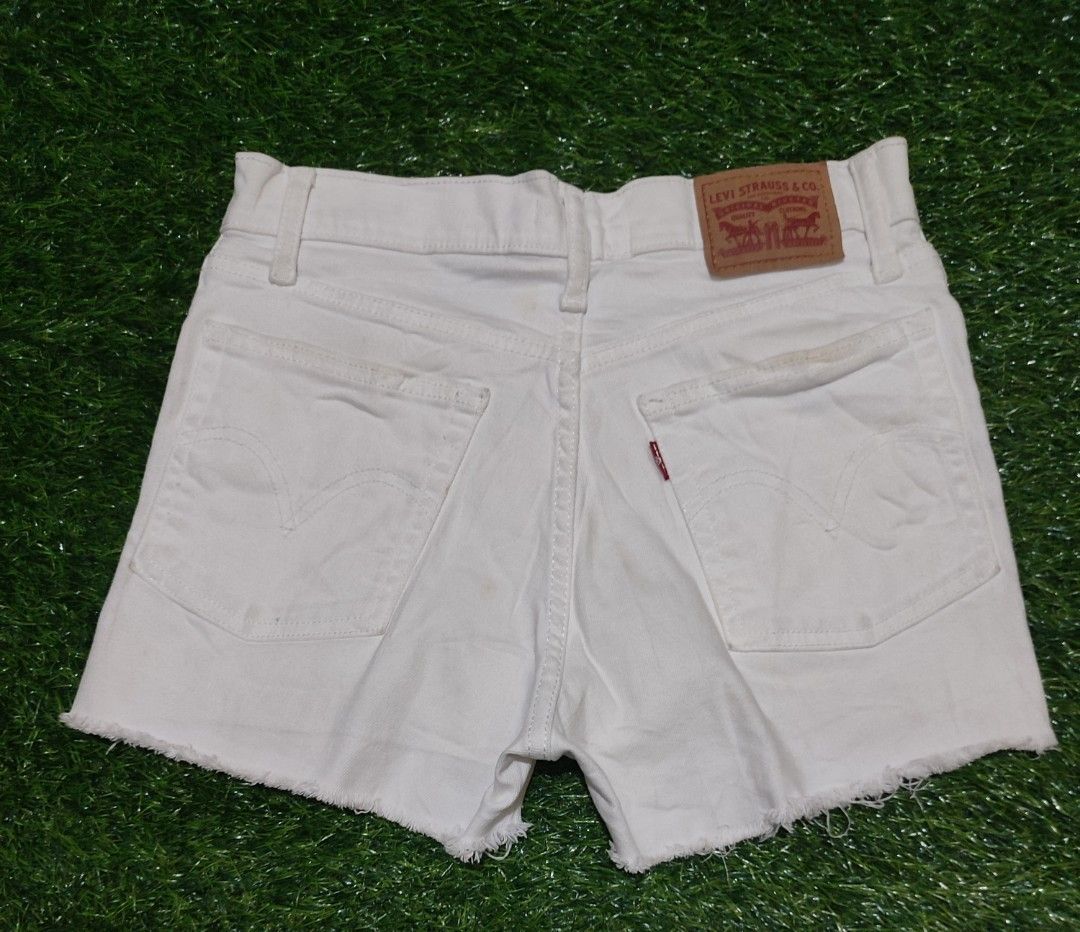 Levi's White High Rise Denim Shorts (Category: Shorts) located in Cebu City. Submitted by deadjay84 (Listing ID 1444492309, Image 2). Description: White Levi's high rise denim shorts - Size 27 on tag - in great condition - Cut-off hem with fraying - zip fly - Distressed leg details - Ideal for summer outfits pls see photos for details cebu loc add shipping .