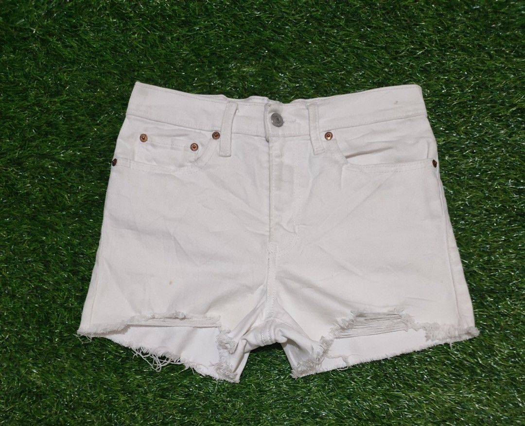 Levi's White High Rise Denim Shorts (Category: Shorts) located in Cebu City. Submitted by deadjay84 (Listing ID 1444492309, Image 1). Description: White Levi's high rise denim shorts - Size 27 on tag - in great condition - Cut-off hem with fraying - zip fly - Distressed leg details - Ideal for summer outfits pls see photos for details cebu loc add shipping .