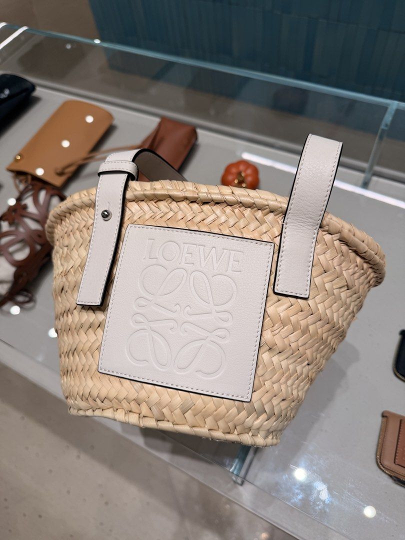 Loewe Straw Basket Bag with White Leather Trim (Category: Luxury Bags & Wallets) located in Taguig. Submitted by sourcedbym (Listing ID 1444320997, Image 2). Description: - Cute Loewe straw basket bag - White leather details - Embossed Loewe logo - Perfect size for essentials - Great for summer outings or beach days - Stylish accessory.