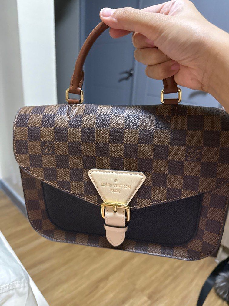 Louis Vuitton Damier Ebene Canvas Bag (Category: Luxury Bags & Wallets) located in Taguig. Submitted by bianca625 (Listing ID 1444411216, Image 1). Description: Authentic original Louis Vuitton Damier Ebene bag with dark brown leather trim. Features a front flap with a gold buckle closure and a top handle. Perfect for daily use. Comes with dustbag, clochette and strap year 2019.