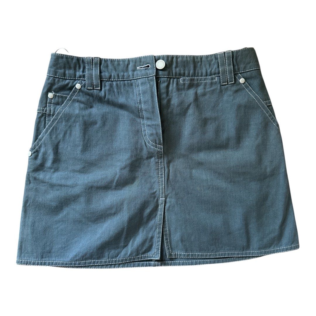 Louis Vuitton Denim Mini Skirt (Authentic) (Category: Luxury Apparel) located in Santa Rosa. Submitted by Minerva_Shelter (Listing ID 1444405581, Image 3). Description: Louis Vuitton Denim Mini Skirt (Authentic) Size on Tag: (38) - medium Measurements: manually measured when laid flat Waist: 15 in Length: 15 in Hip: 19 in Leg opening: 20 in Design: - This is an authentic Louis Vuitton piece - Every material used to make this skirt has the LV sign