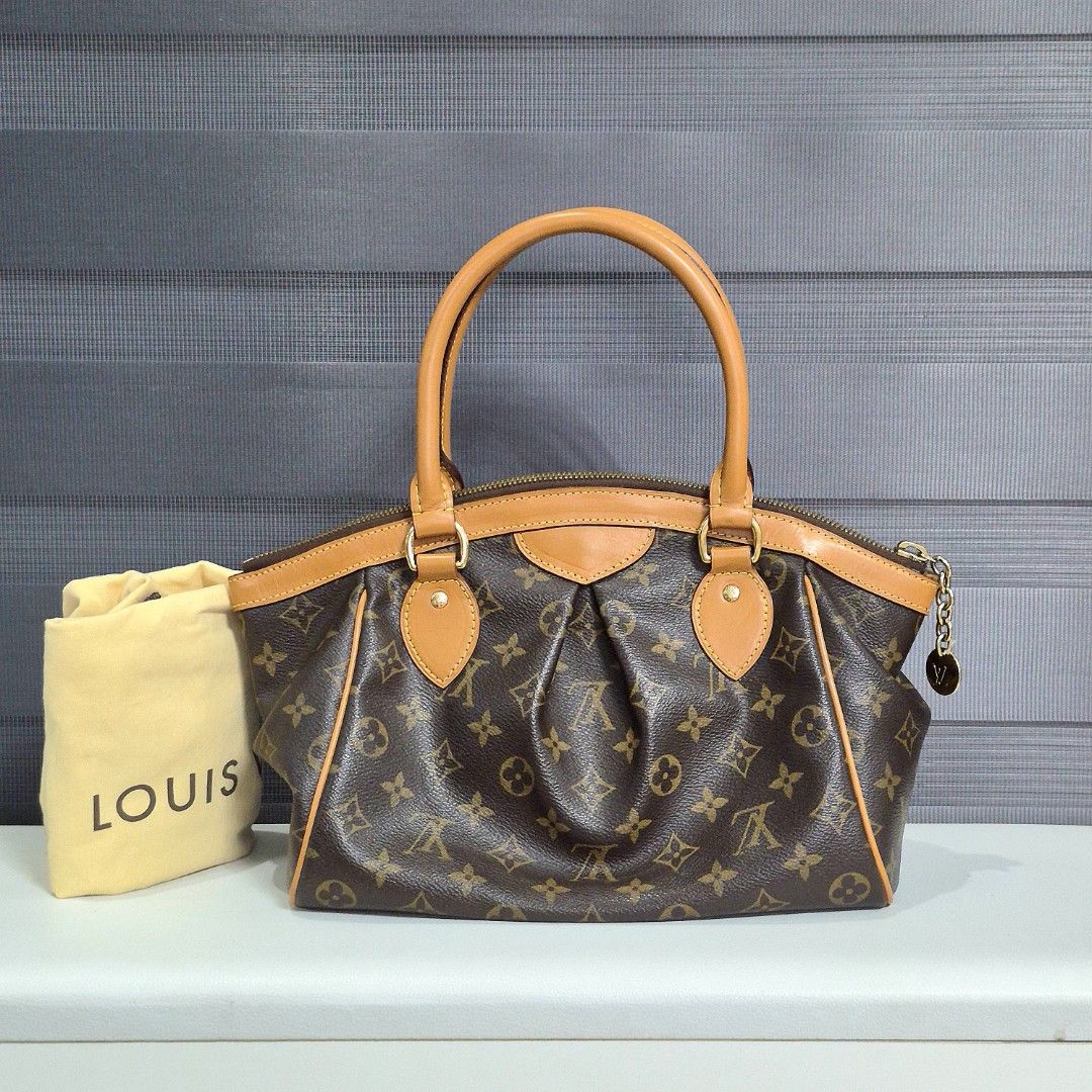 Louis Vuitton Monogram Tivoli PM Shoulder Bag (Category: Luxury Bags & Wallets) located in Manila. Submitted by cara.ser (Listing ID 1444358175, Image 2). Description: - Authentic Louis Vuitton Monogram tivoli pm - Classic monogram canvas with natural cowhide leather trim - Gold-tone hardware - Interior features multiple pockets - Comes with original dust bag - Ideal for everyday use -Excellent condition -Guaranteed authentic.