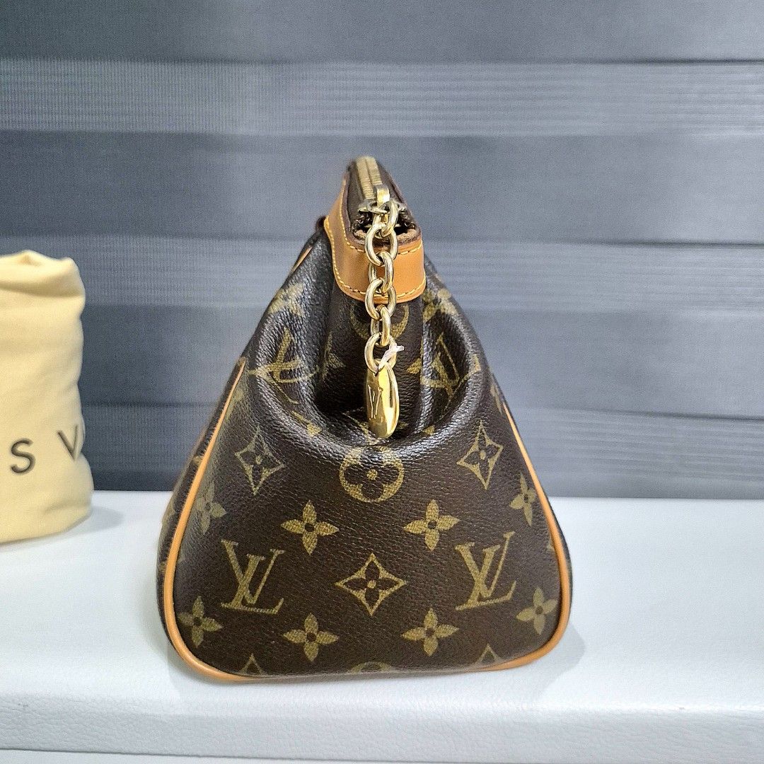 Louis Vuitton Monogram Tivoli PM Shoulder Bag (Category: Luxury Bags & Wallets) located in Manila. Submitted by cara.ser (Listing ID 1444358175, Image 3). Description: - Authentic Louis Vuitton Monogram tivoli pm - Classic monogram canvas with natural cowhide leather trim - Gold-tone hardware - Interior features multiple pockets - Comes with original dust bag - Ideal for everyday use -Excellent condition -Guaranteed authentic.