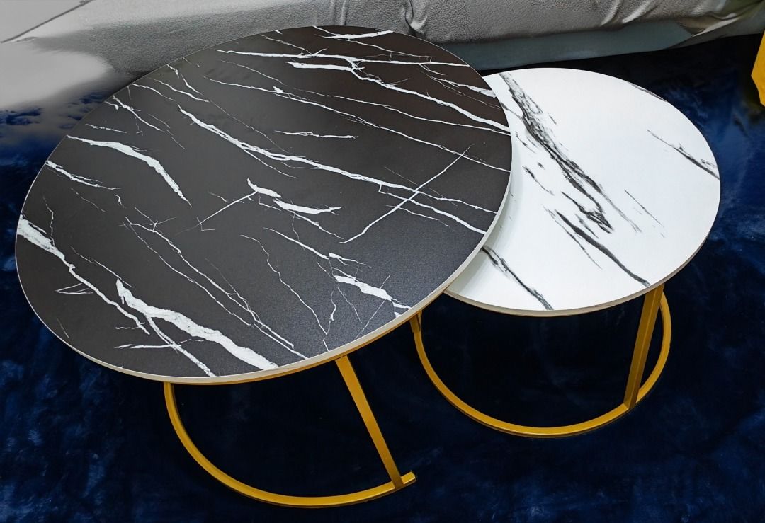 Marble Design Nesting Coffee Tables (70cm & 50cm) (Category: Tables & Sets) located in Manila. Submitted by mysticmountain-17d9 (Listing ID 1444458790, Image 2). Description: - Set of 2 round nesting coffee tables - Elegant black and white marble design - Large table: 70cm diameter - Small table: 50cm diameter - Stylish gold metal legs - Perfect for living rooms and lounges - Versatile: use together or separately.