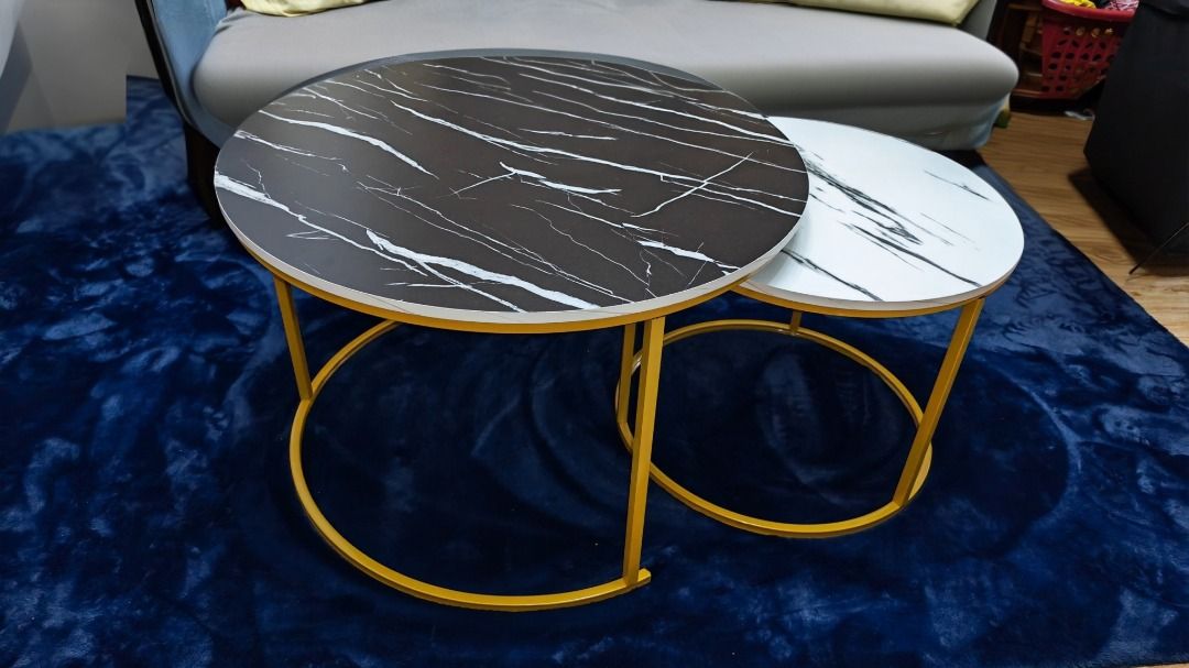 Marble Design Nesting Coffee Tables (70cm & 50cm) (Category: Tables & Sets) located in Manila. Submitted by mysticmountain-17d9 (Listing ID 1444458790, Image 3). Description: - Set of 2 round nesting coffee tables - Elegant black and white marble design - Large table: 70cm diameter - Small table: 50cm diameter - Stylish gold metal legs - Perfect for living rooms and lounges - Versatile: use together or separately.