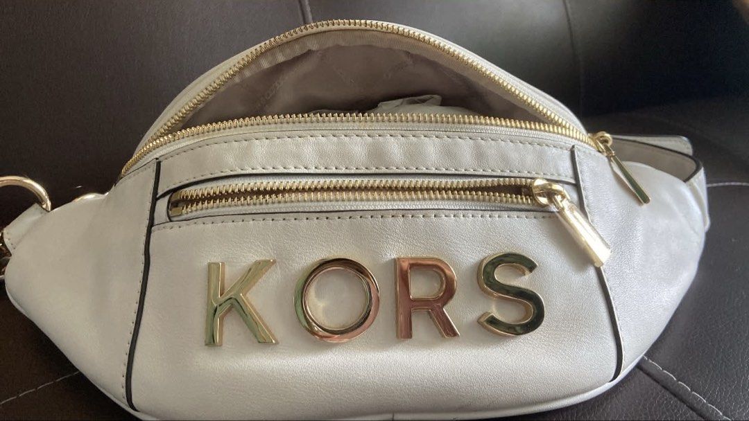 Michael Kors White Belt Bag (Category: Luxury Bags & Wallets) located in Manila. Submitted by joe.an (Listing ID 1444386868, Image 2). Description: - Authentic Michael Kors white leather fanny pack - Elegant gold hardware and zippers - Adjustable strap for comfortable wear - Spacious main compartment - Convenient front zip pocket - Ideal for keeping essentials accessible and hands-free - Interior is clean and well-maintained - Can be work either 