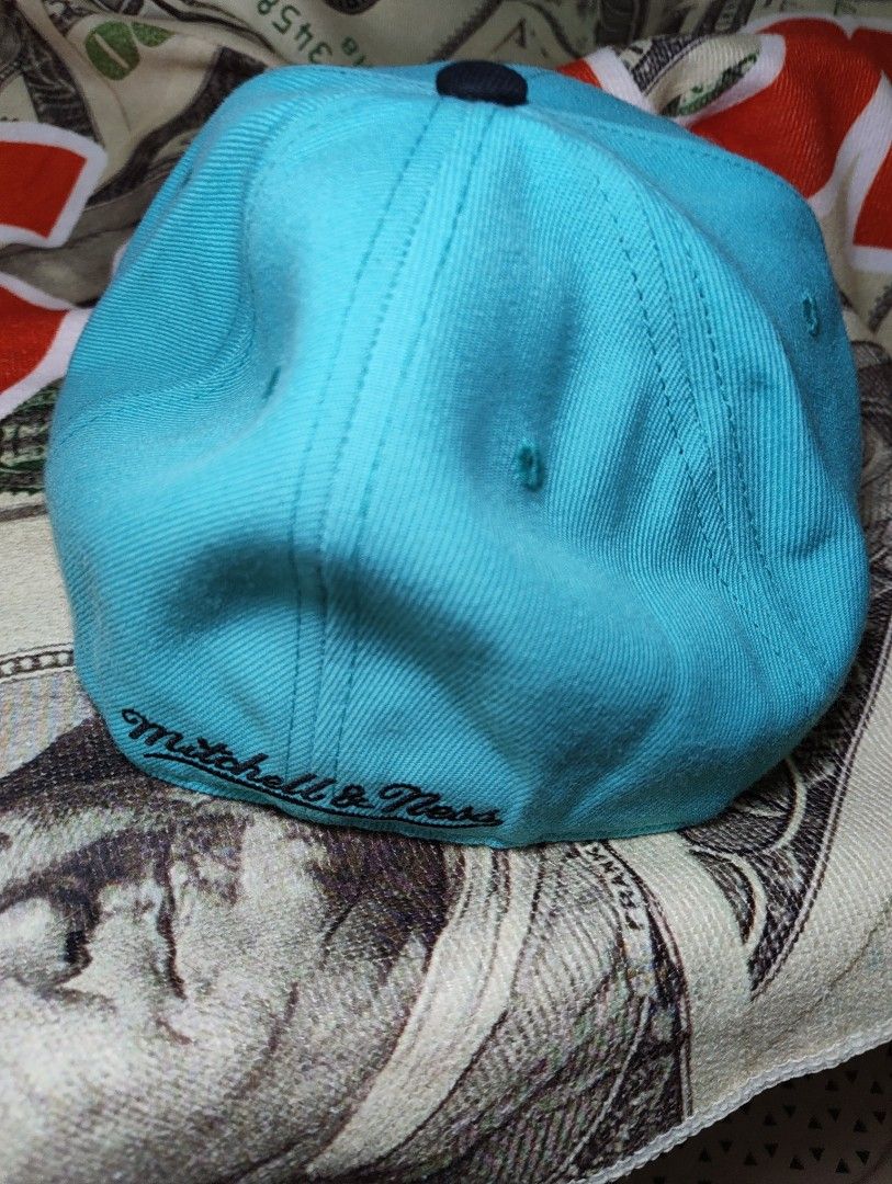 Mitchell & Ness San Antonio Spurs Snapback Cap (Category: Caps & Hats) located in Quezon City. Submitted by 0nestopshop (Listing ID 1444483367, Image 3). Description: - San Antonio Spurs snapback cap - Brand: Mitchell & Ness - Colorway: Teal and Black - Features classic Spurs logo on front - Size: 7 1/8 - Part of the Dynasty Fitted Collection - Perfect for any Spurs fan! ‼️PAUBOS STEAL BAWAS STOCK‼️ 7 1/8 polyester materials 60 USD ‼️1,200 na lng