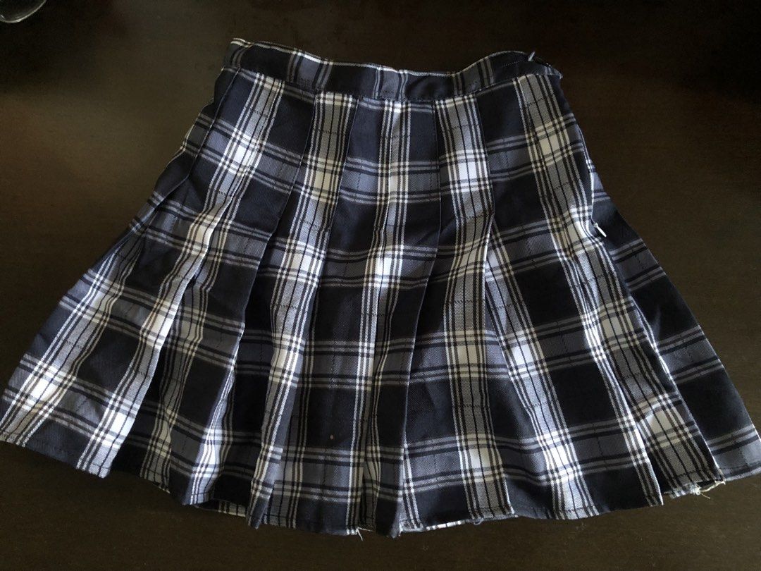 Navy and White Plaid Pleated Mini Skirt (Category: Skirts) located in Manila. Submitted by ninin03 (Listing ID 1444359207, Image 1). Description: - Cute navy and white plaid pattern - Mini length - School uniform aesthetic - Versatile for casual or dressed-up outfits - Easy to pair with various tops and shoes.