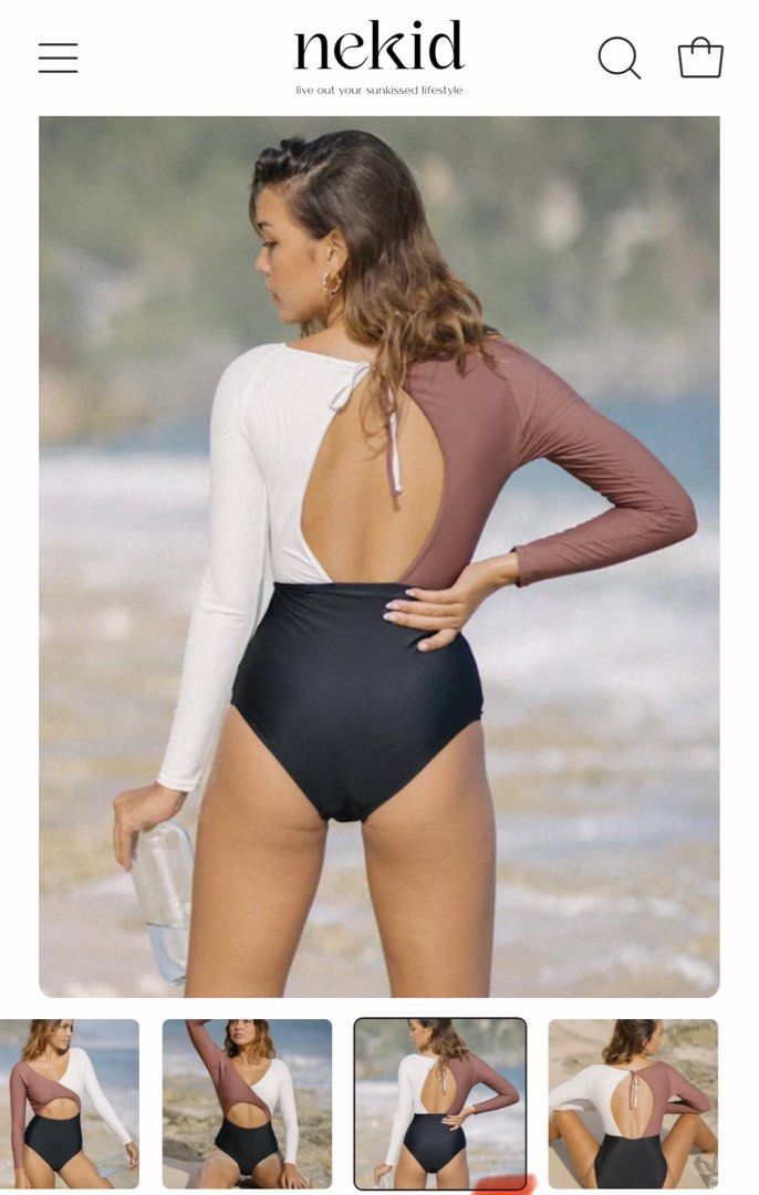 Nekid Long Sleeve One Piece Swimsuit (Category: Bikinis & Swimsuits) located in Antipolo. Submitted by hm_cyst (Listing ID 1444331734, Image 2). Description: - Brand: Nekid - Style: Long sleeve one-piece swimsuit - Design: Colorblock with white and mauve sleeves - Bottom: High-waisted black - Features: Open back with tie detail - Ideal for: Surfing, swimming - Benefits: Comfortable and stylish.