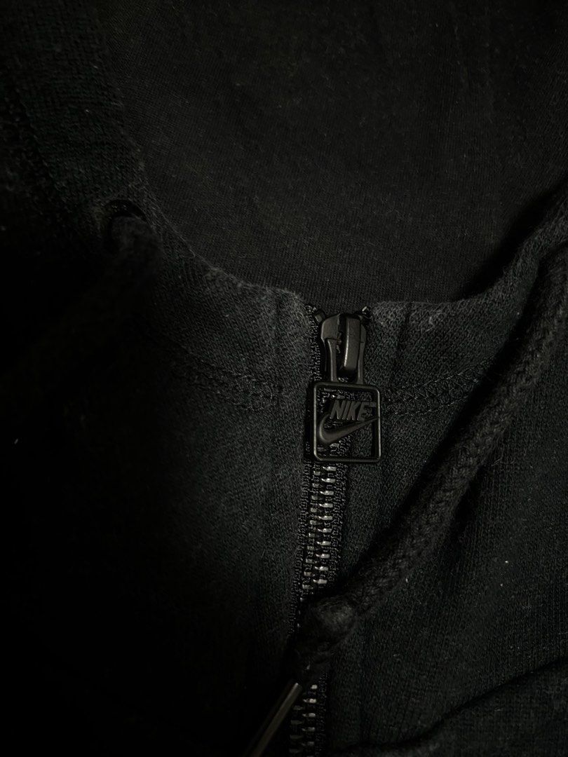 Nike Black Zip-Up Hoodie (Category: Coats, Jackets and Outerwear) located in Manila. Submitted by since2021_ (Listing ID 1444417104, Image 3). Description: - Classic black Nike hoodie - Full zip closure - Embroidered Nike swoosh logo on chest - Front pouch pocket - Drawstring hood - Ideal for everyday wear or workouts.