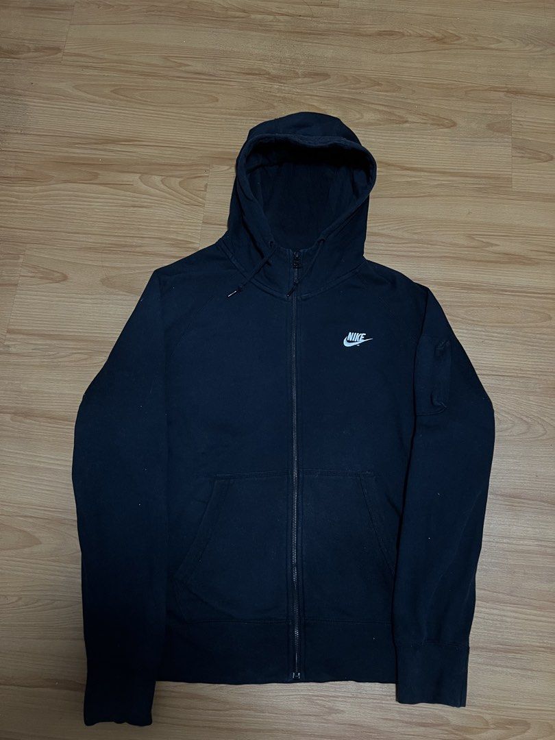 Nike Black Zip-Up Hoodie (Category: Coats, Jackets and Outerwear) located in Manila. Submitted by since2021_ (Listing ID 1444417104, Image 1). Description: - Classic black Nike hoodie - Full zip closure - Embroidered Nike swoosh logo on chest - Front pouch pocket - Drawstring hood - Ideal for everyday wear or workouts.