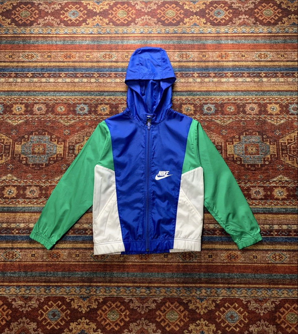 Nike Colorblock Hooded Windbreaker Jacket M (Category: Coats, Jackets and Outerwear) located in Lingayen. Submitted by hiddeninattic (Listing ID 1444487061, Image 1). Description: - Nike Windbreaker - Size: Medium (M) - Colors: Blue, Green, White - Features: Hooded, Full Zip Front, Elastic Cuffs and Hem - Origin: Made in Vietnam - Ideal for: Layering, light rain protection - Dimension’s Width 17.5 Length 22.