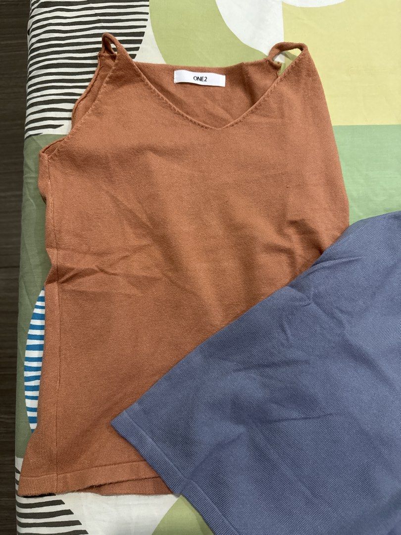 ONE2 Camisole Tops (2 pcs) - Brown & Blue (Category: Sleeveless) located in Manila. Submitted by 031620 (Listing ID 1444343672, Image 2). Description: - Set of two ONE2 camisole tops - Colors: Warm brown and cool blue - V-neckline design - Versatile for layering or wearing solo - Ideal for casual outfits.