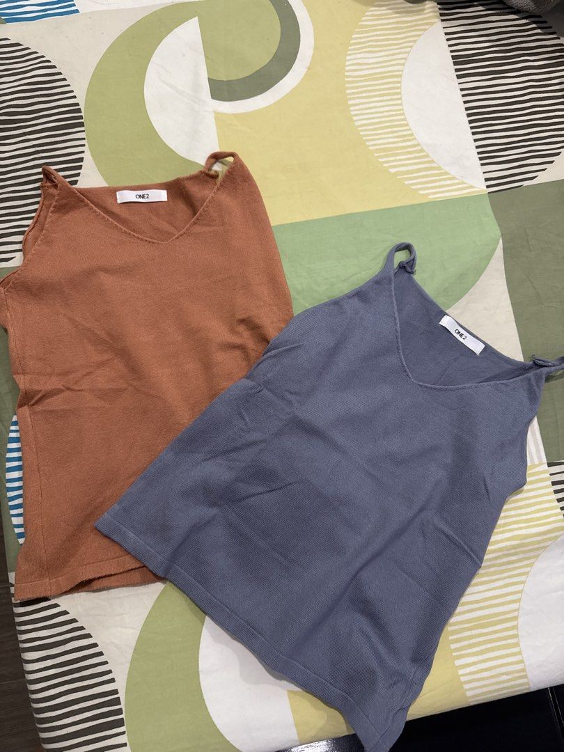 ONE2 Camisole Tops (2 pcs) - Brown & Blue (Category: Sleeveless) located in Manila. Submitted by 031620 (Listing ID 1444343672, Image 1). Description: - Set of two ONE2 camisole tops - Colors: Warm brown and cool blue - V-neckline design - Versatile for layering or wearing solo - Ideal for casual outfits.