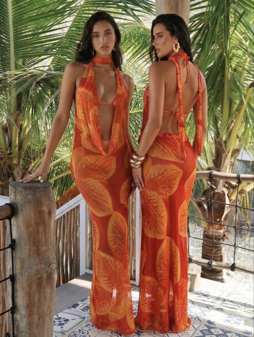 Orange Leaf Print Halter Neck Maxi Dress (Category: Dresses) located in Manila. Submitted by 8728___ (Listing ID 1444310549, Image 1). Description: - Flowy orange maxi dress - Bold leaf print - Halter neck - Daring open front - Sheer fabric drapes beautifully - Perfect for beach vacations or summer parties - ₱414 is the original price - DM me if you want a when worn pictures.