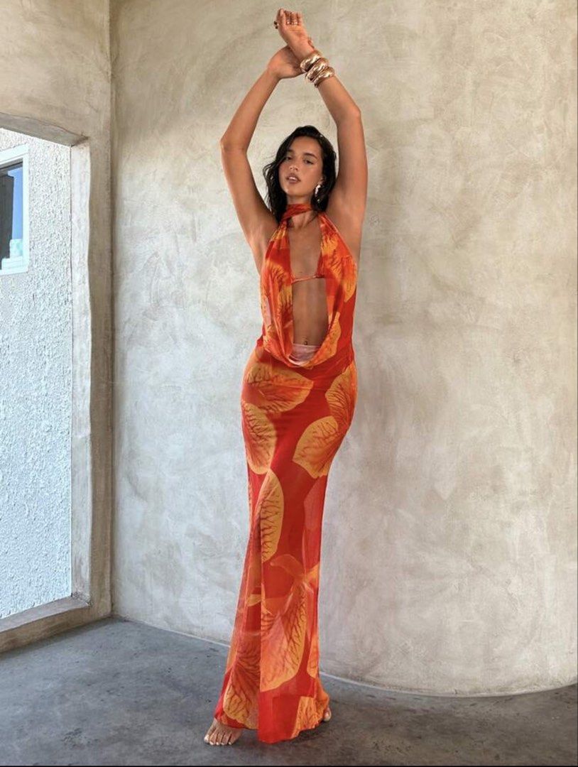 Orange Leaf Print Halter Neck Maxi Dress (Category: Dresses) located in Manila. Submitted by 8728___ (Listing ID 1444310549, Image 3). Description: - Flowy orange maxi dress - Bold leaf print - Halter neck - Daring open front - Sheer fabric drapes beautifully - Perfect for beach vacations or summer parties - ₱414 is the original price - DM me if you want a when worn pictures.