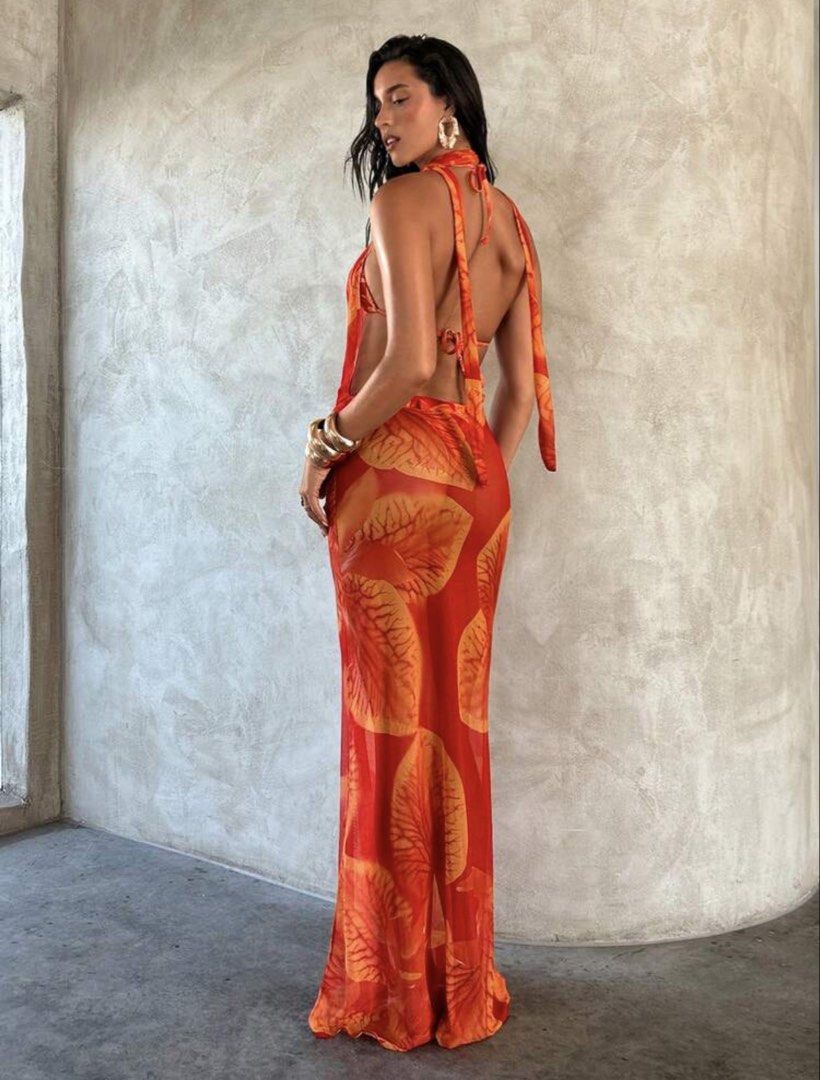 Orange Leaf Print Halter Neck Maxi Dress (Category: Dresses) located in Manila. Submitted by 8728___ (Listing ID 1444310549, Image 2). Description: - Flowy orange maxi dress - Bold leaf print - Halter neck - Daring open front - Sheer fabric drapes beautifully - Perfect for beach vacations or summer parties - ₱414 is the original price - DM me if you want a when worn pictures.