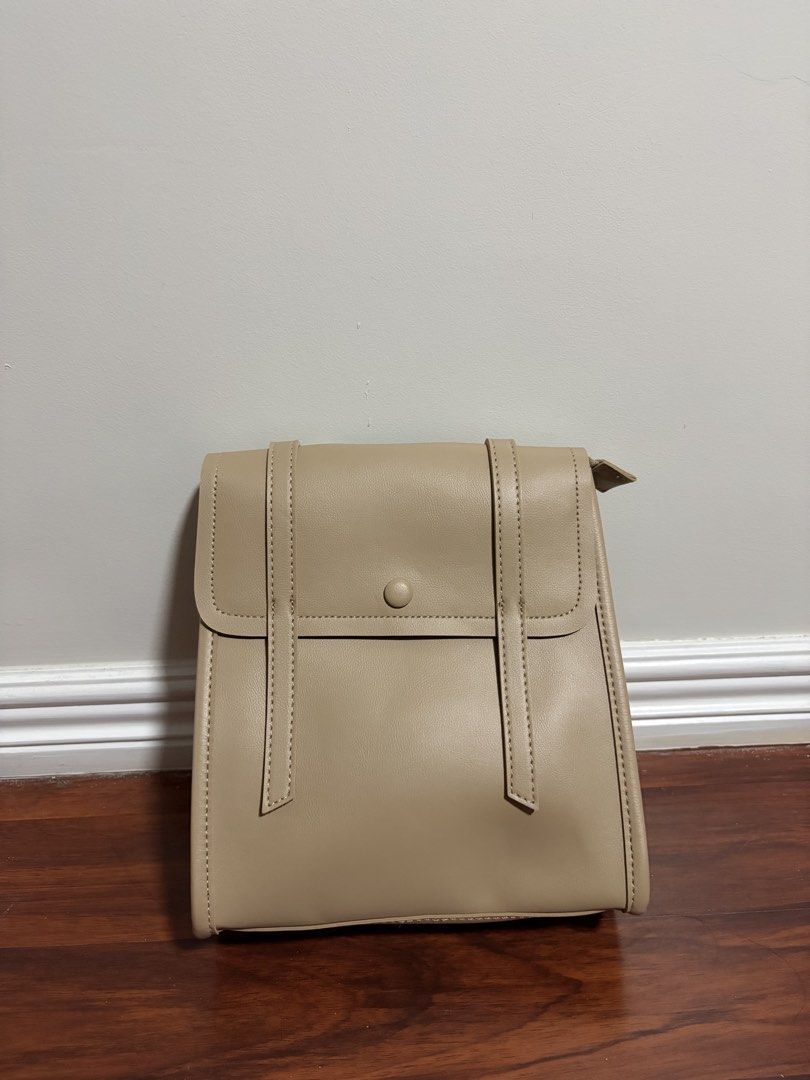Parisian Beige Faux Leather Backpack (Category: Backpacks) located in Valenzuela. Submitted by pencakes_ (Listing ID 1444435197, Image 1). Description: khaki small bag perfect for school only opened, never been used rfs - decluttering shipping fee will be shouldered by the buyer :).