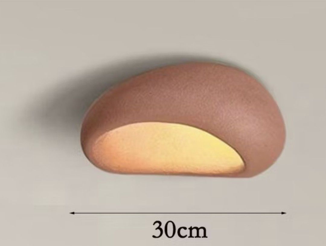 Pebble Shape Wall Light - 30cm tricolor (Category: Lighting) located in Quezon City. Submitted by lyn.22 (Listing ID 1444496602, Image 1). Description: - Unique pebble-shaped wall light - Provides a warm, ambient glow (tricolor) - Natural textured finish for a cozy feel - 30cm in length -tricolor - Ideal for hallways, bedrooms, or living areas - Easy to install.